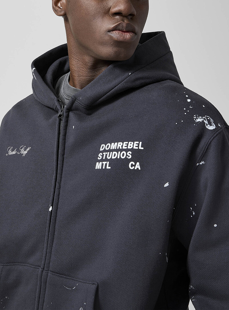 DOMREBEL Black Studio Staff splattered paint zip-up hoodie for men