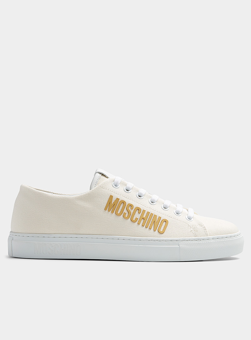 Moschino: Le sneaker court logo doré Homme Blanc pour homme