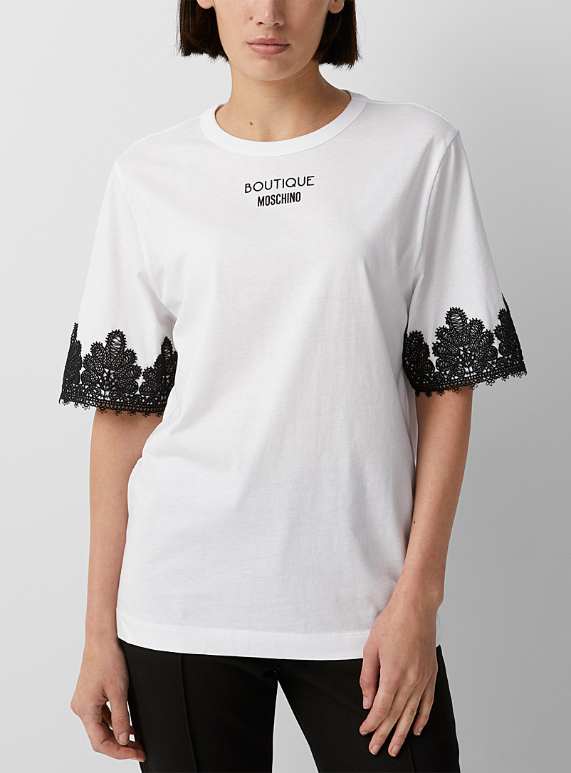 BOUTIQUE Moschino: Le t-shirt manches bordées dentelle Blanc à motifs pour femme