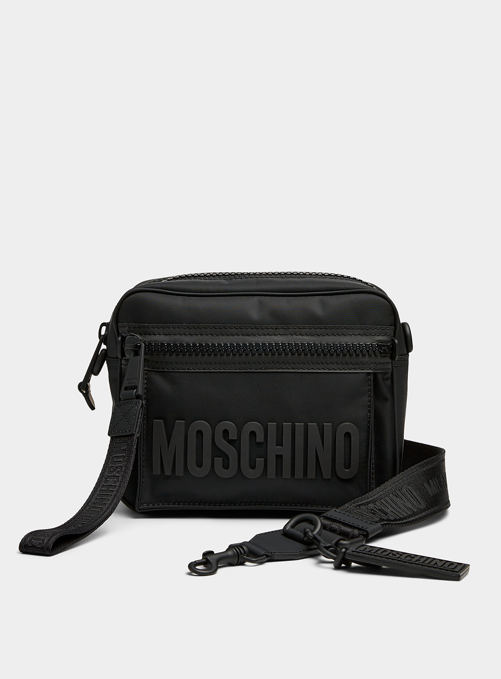 Shop Moschino Embossed Signature Crossbody Bag In Black