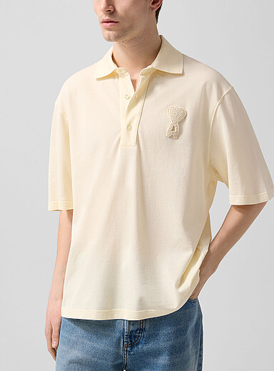 Ami: Le polo piqu&eacute; logo crochet Blanc cass&eacute; pour homme