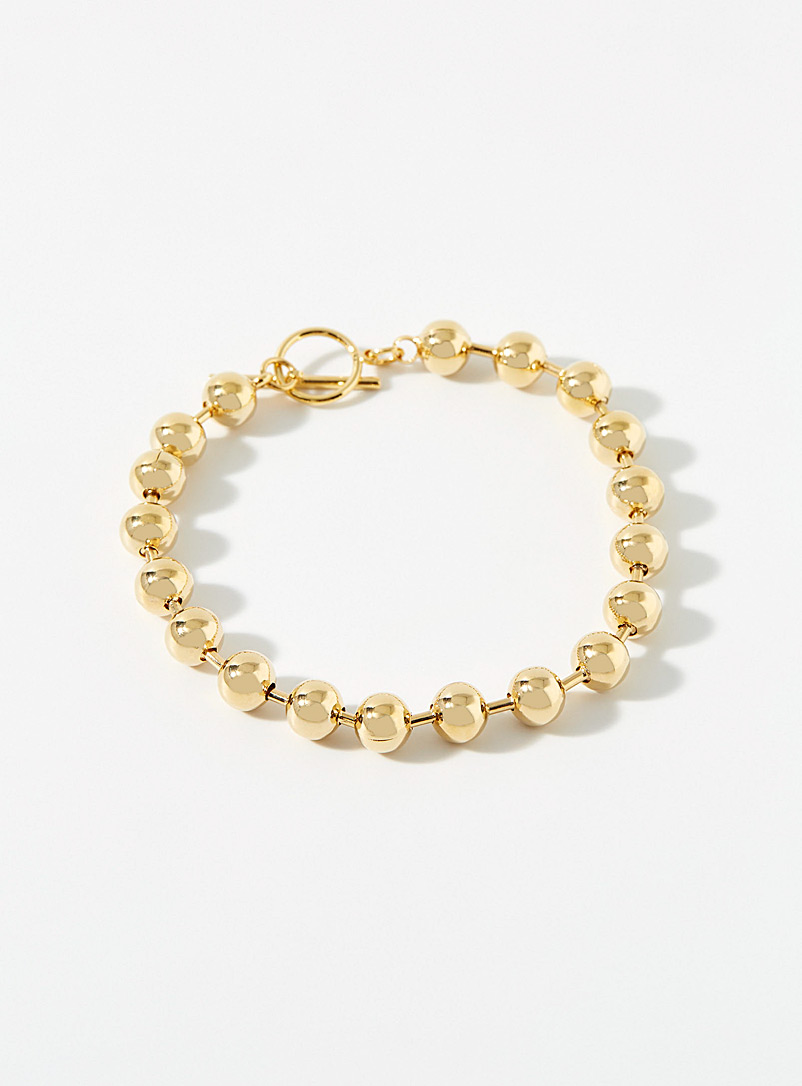 Orelia: Le bracelet billes dorées Assorti pour femme