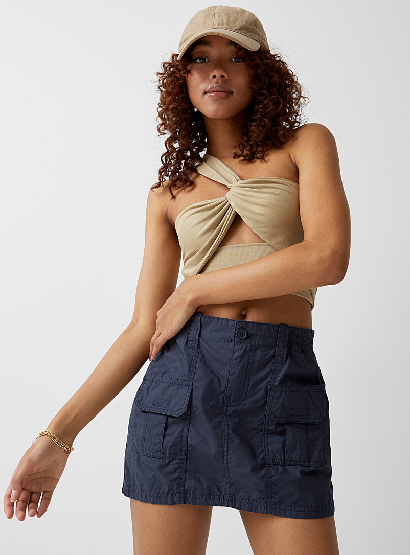 Twik: La minijupe toile poches à rabat Marine pour femme