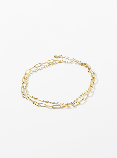 La double cha&icirc;ne de cheville dor&eacute;e
