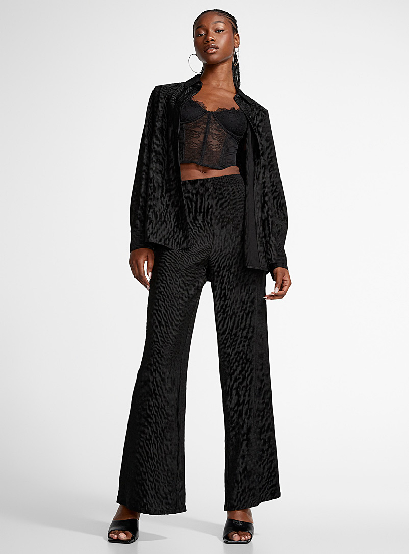 Icône: Le pantalon large satin plissé Noir pour femme