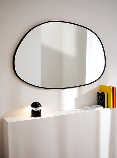 Asymmetrical oval mirror