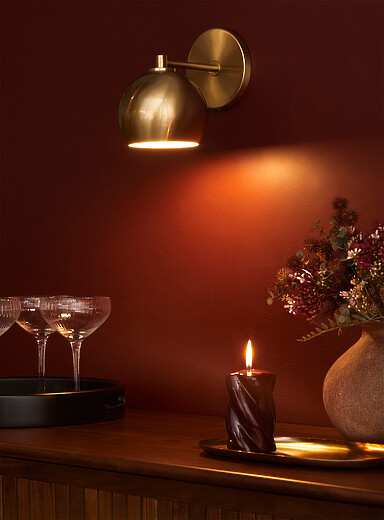 Sleek spehrical shade wall sconce