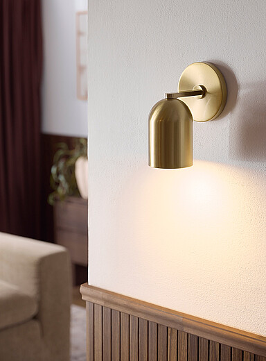 Brass finish domed wall sconce