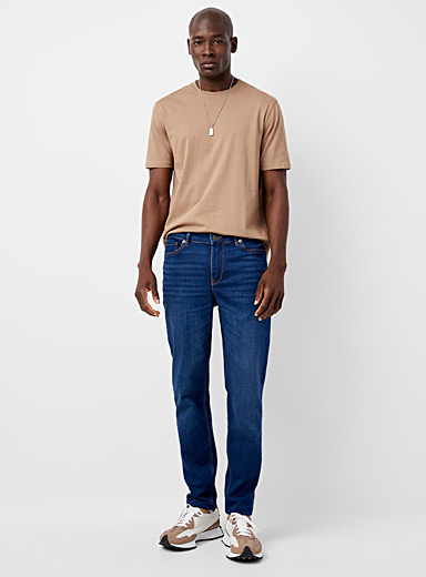 https://imagescdn.simons.ca/images/13478-215540-41-A1_3/ochre-topstitched-faux-knit-blue-jean-stockholm-fit-slim.jpg?__=3