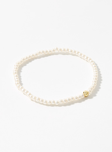 Le bracelet billes nacr&eacute;es accent dor&eacute;