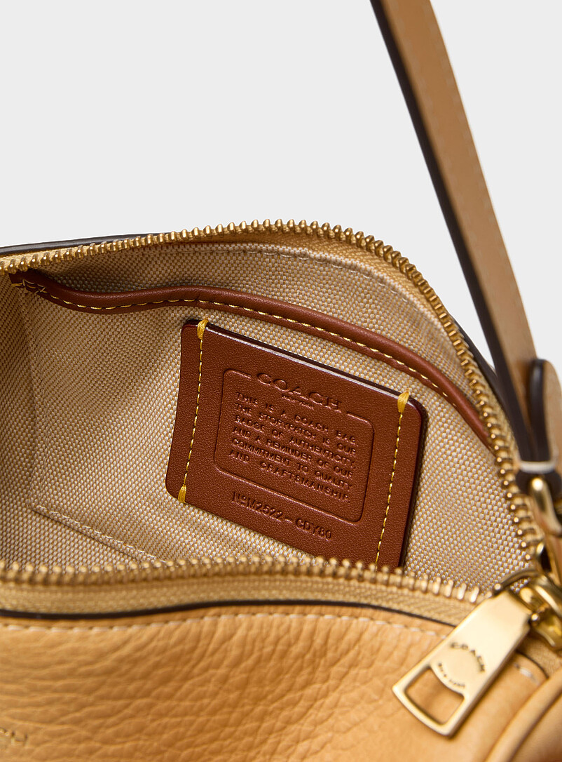 Coach: Le petit sac cylindrique cuir lisse Ivoire - Beige cr&egrave;me pour femme