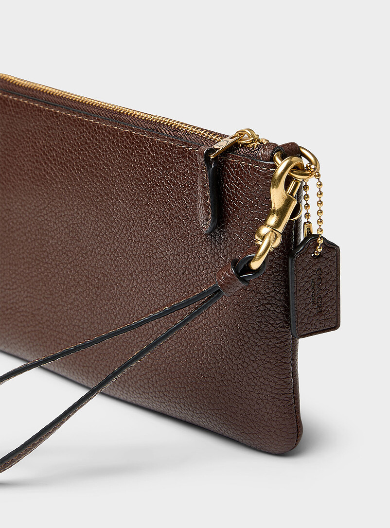 Coach: La pochette zipp&eacute;e cuir avec dragonne Noir pour femme