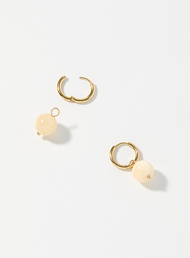 Les boucles d'oreilles Soleil