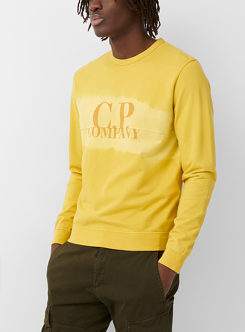 C.P. Company: Le sweat couleur effet tie-dye Jaune or pour homme