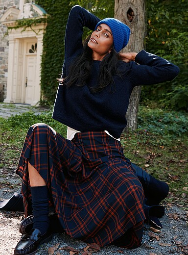 Asymmetrically draped plaid skirt