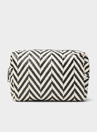 Black and white zigzag cosmetics case with bottles