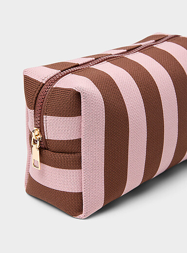Striped cosmetics case with bottles