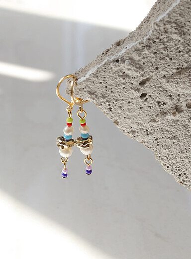 Les boucles d'oreilles Dapi