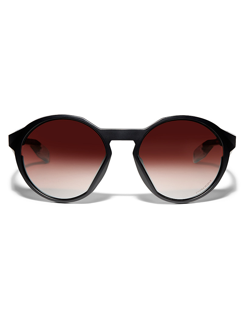 Oakley: Les lunettes de soleil rondes Clifden Noir pour homme