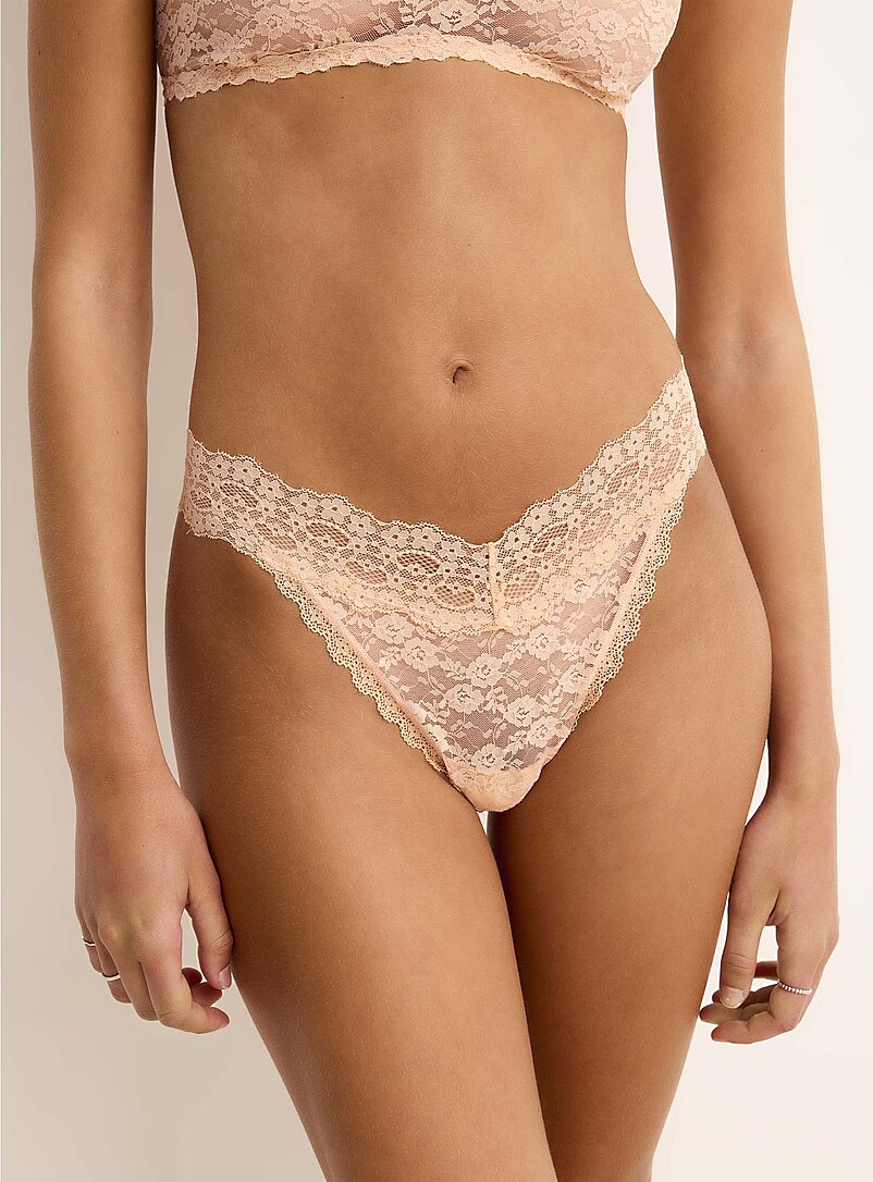 Miiyu: Le tanga pure dentelle Nylon recycl&eacute; P&ecirc;che pour femme