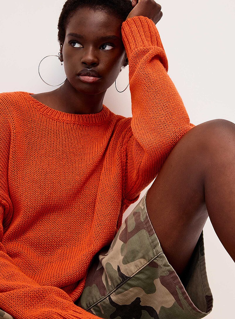 Twik Orange Reverse seams loose sweater for women