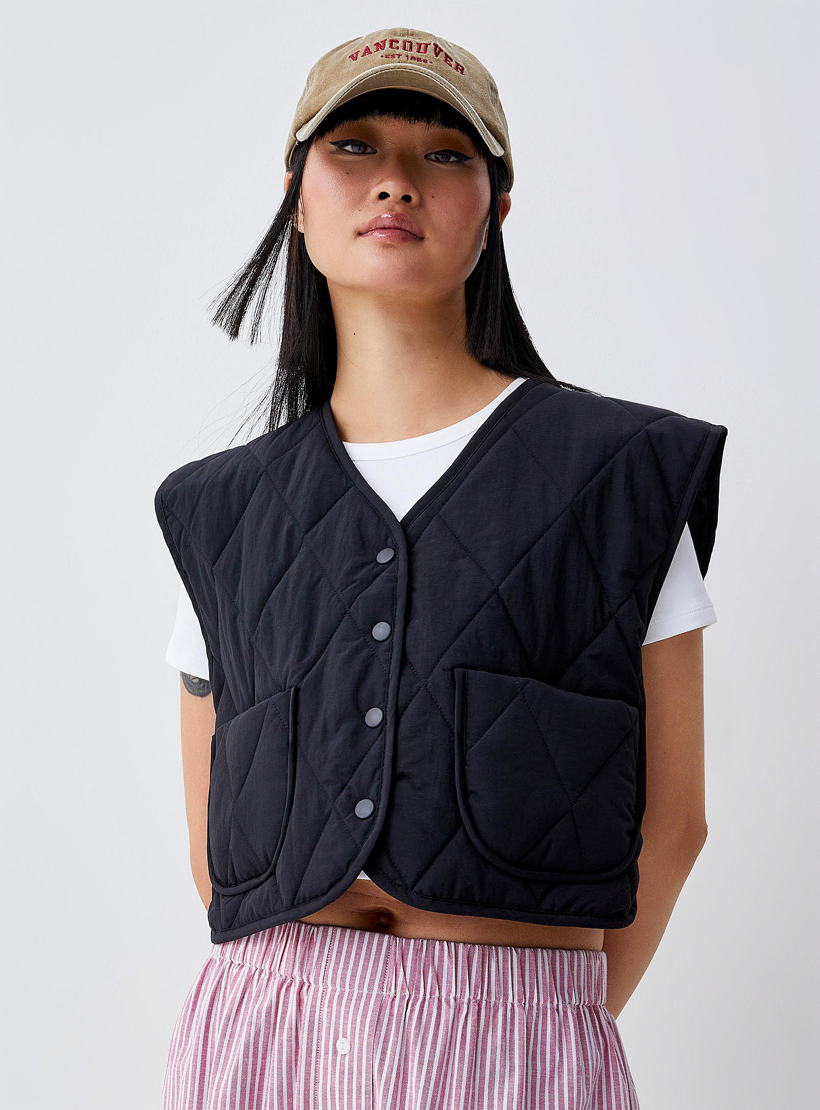 Twik Quilted Sleeveless Boxy-fit Jacket In Black