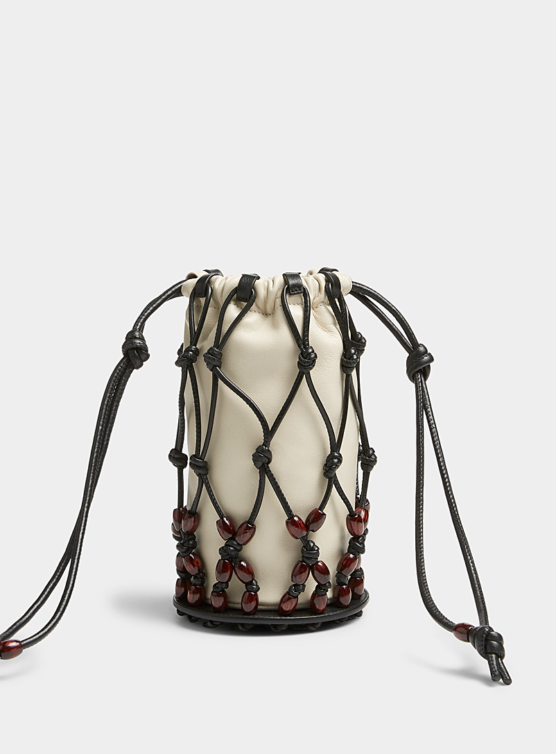 Hereu: Le sac seau lanières nouées Perlata Noir à motifs pour femme