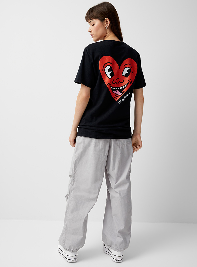 Twik: Le t-shirt coeur grimaçant Keith Haring Noir pour femme