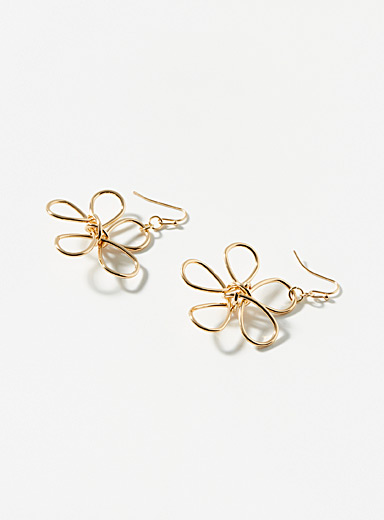 Les boucles d'oreilles grande silhouette florale