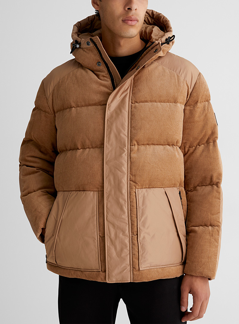 Dual-material quilted jacket