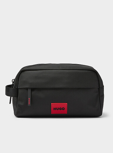 La trousse de voyage &eacute;cusson rouge