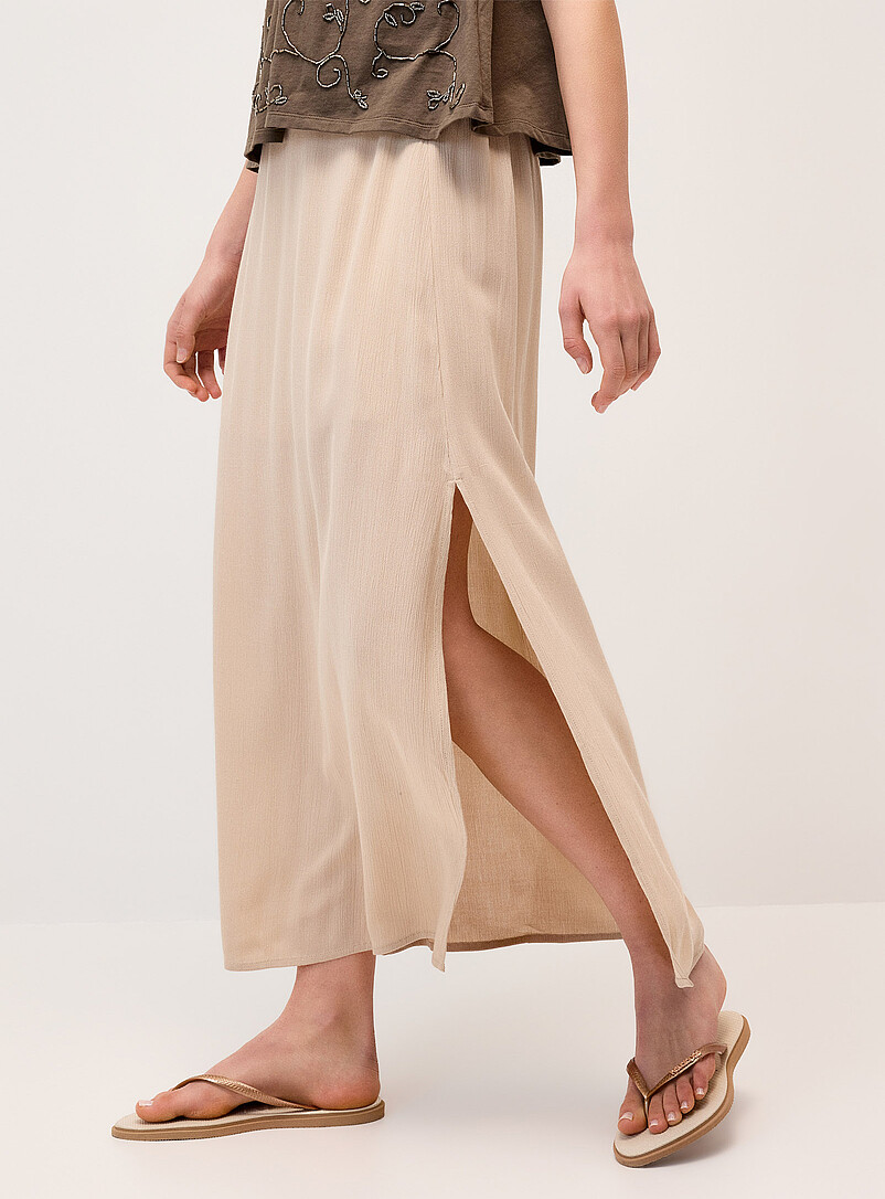 Twik: La jupe longue fendue cr&ecirc;pe textur&eacute; Soleils pour femme