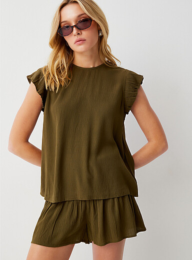La blouse col rond manches volants