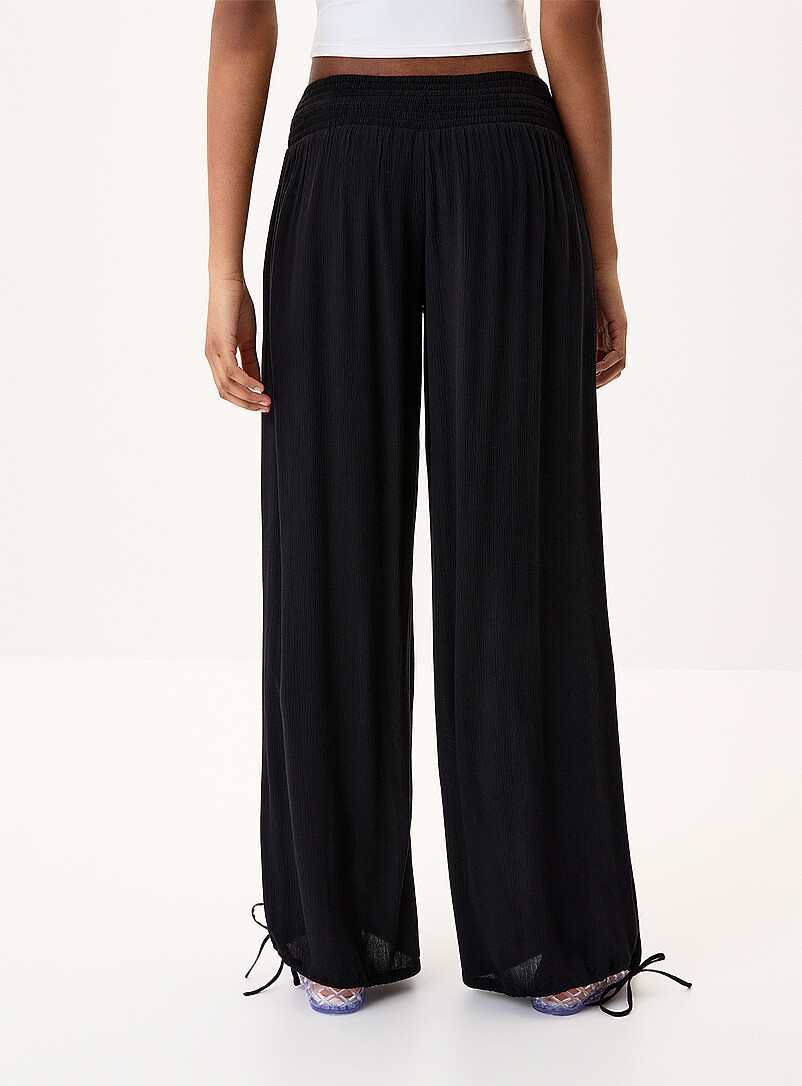 Twik Black Smocked-waist crinkled-finish pant for women