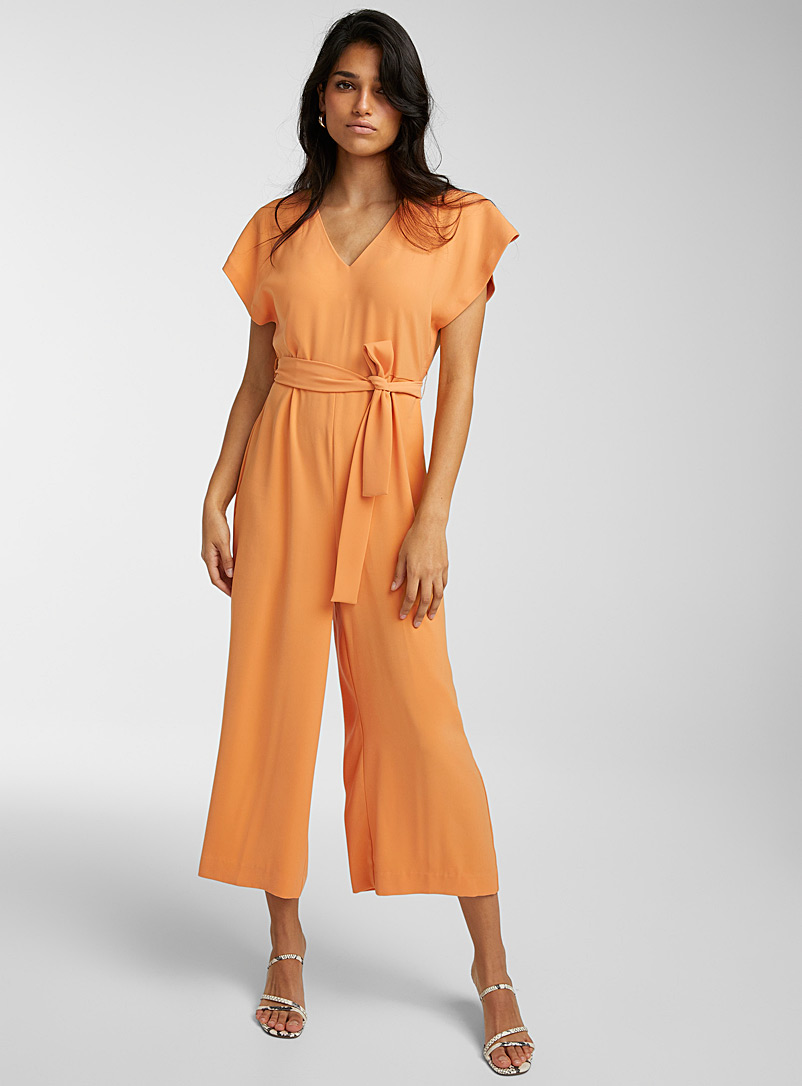 Icône: La combinaison manches cape ceinturée Orange pour femme