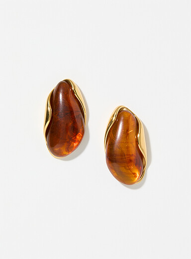 Les grandes boucles d'oreilles pierres et dorures