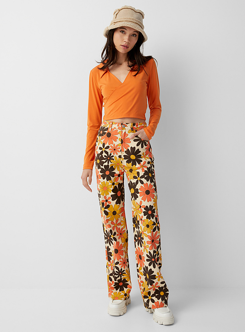 Twik: Le jean large fleurs rétro Orange à motifs pour femme