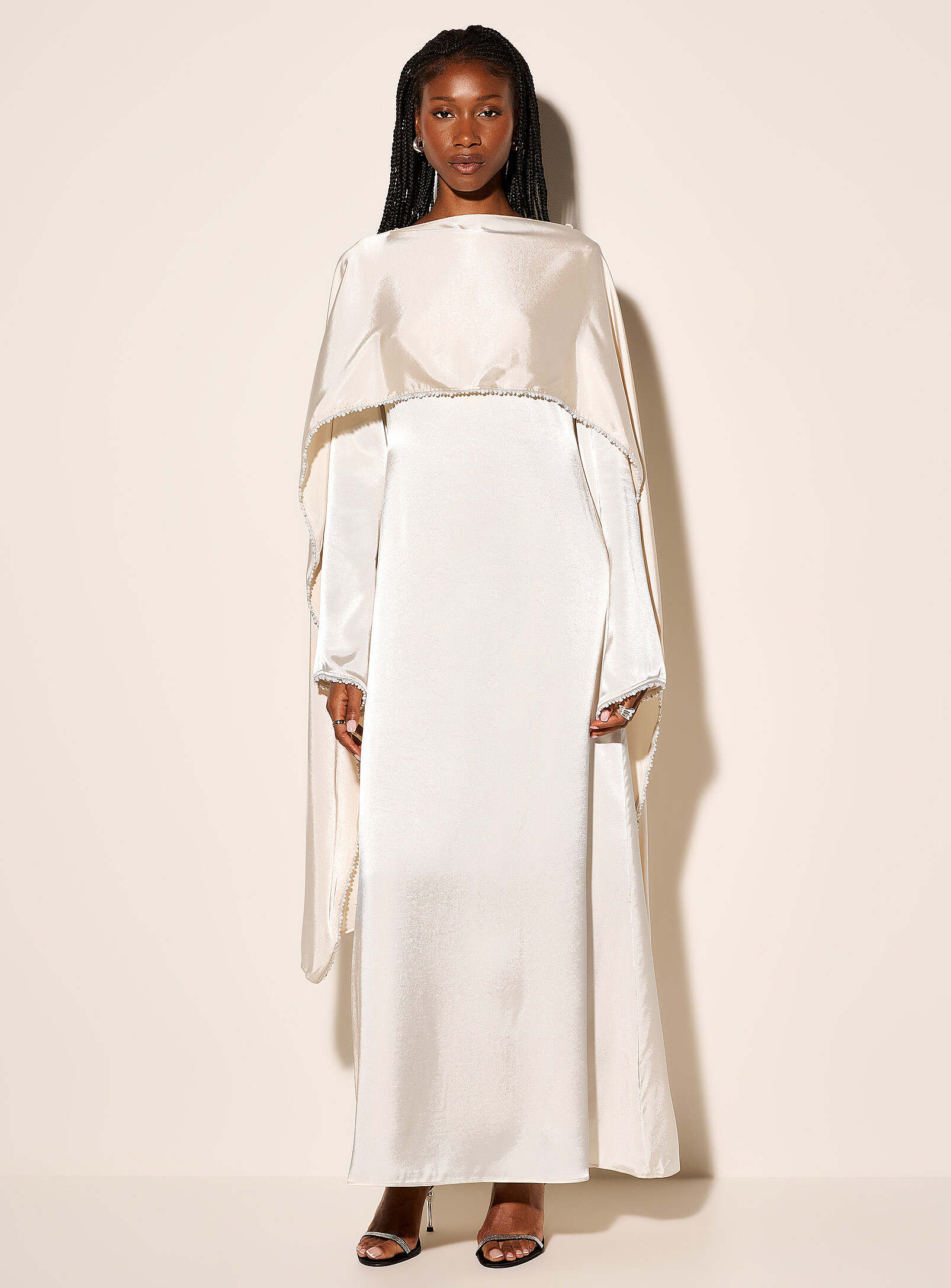 Pearl-trimmed long satiny caped dress