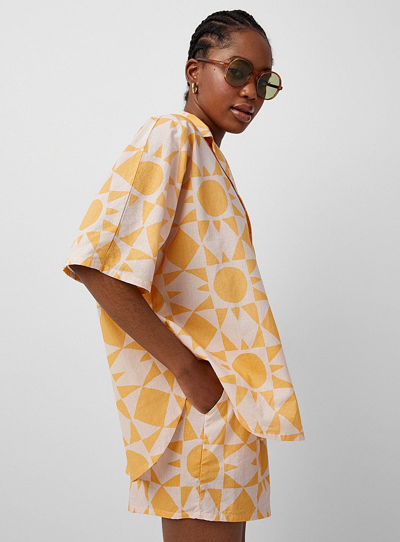 Soleil soleil: La chemise ample imprimé soleil Orange à motifs pour femme