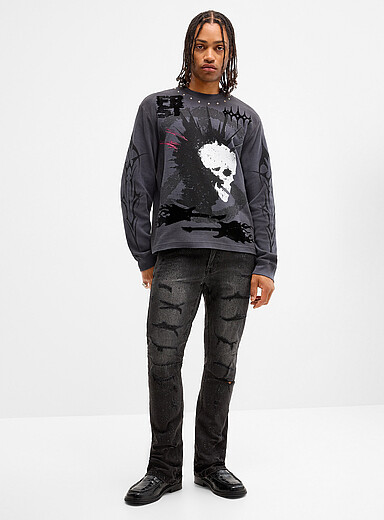Le jean d&eacute;chir&eacute; noir strass scintillant <b>Coupe semi-&eacute;vas&eacute;e</b>