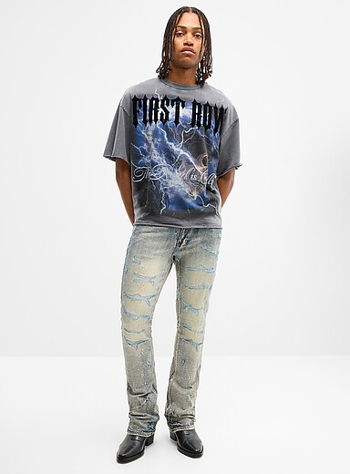 Le jean d&eacute;lav&eacute; d&eacute;chir&eacute; strass scintillant <b>Coupe semi-&eacute;vas&eacute;e</b>
