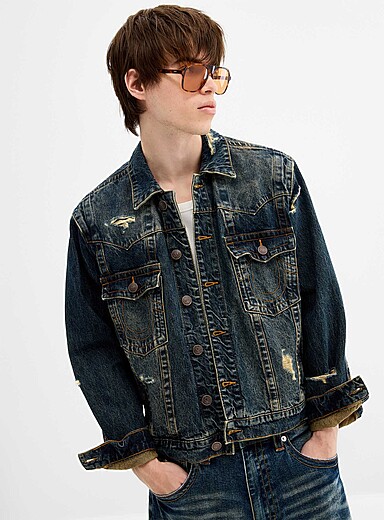 La veste en jean indigo us&eacute;