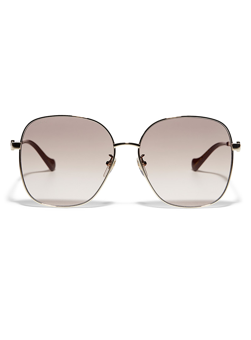 Gucci: Le lunettes de soleil carrées à monture dorée Brun pour femme