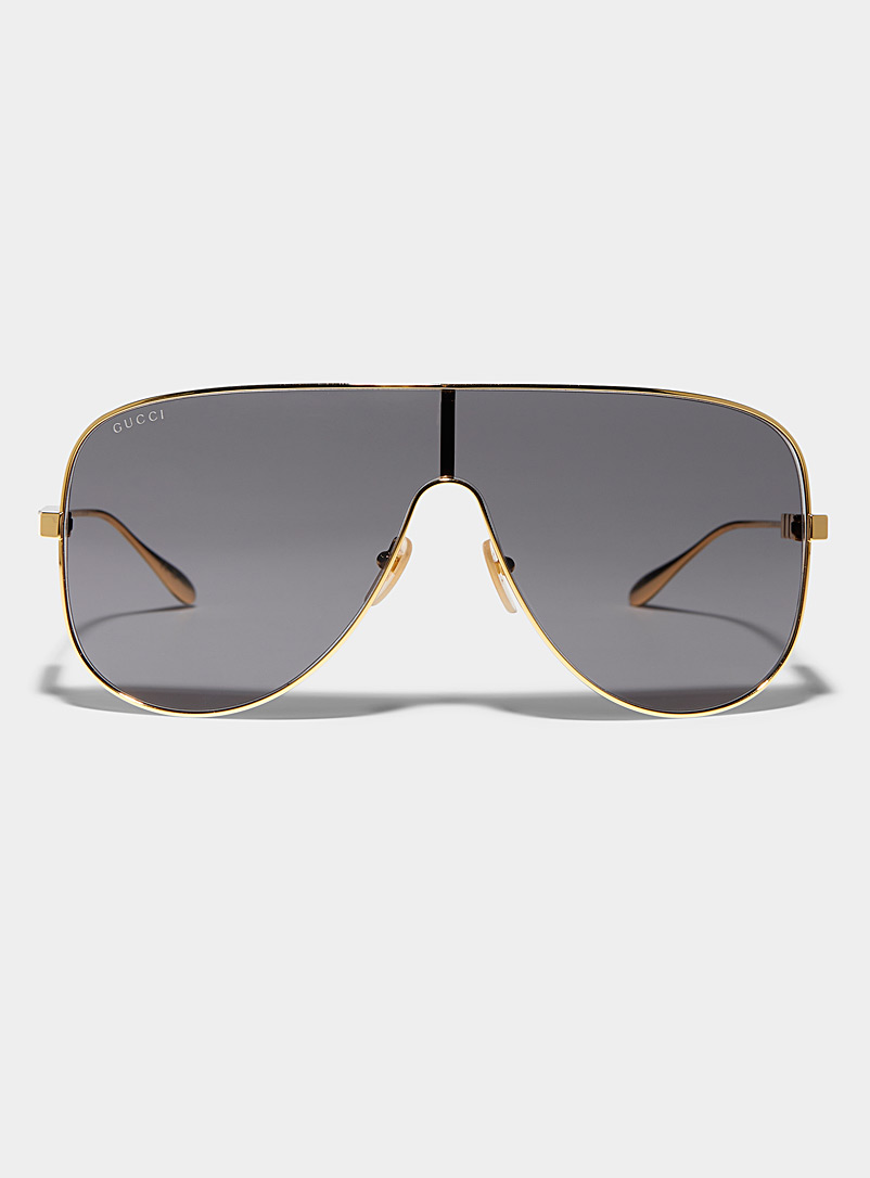 Gucci: Les lunettes de soleil visière dorées Noir pour femme