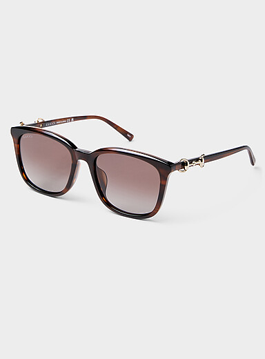 Les lunettes de soleil carr&eacute;es branches ornement&eacute;es