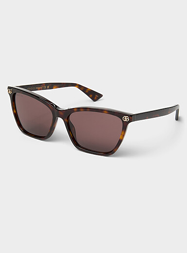Les lunettes de soleil fines carr&eacute;es logo dor&eacute;