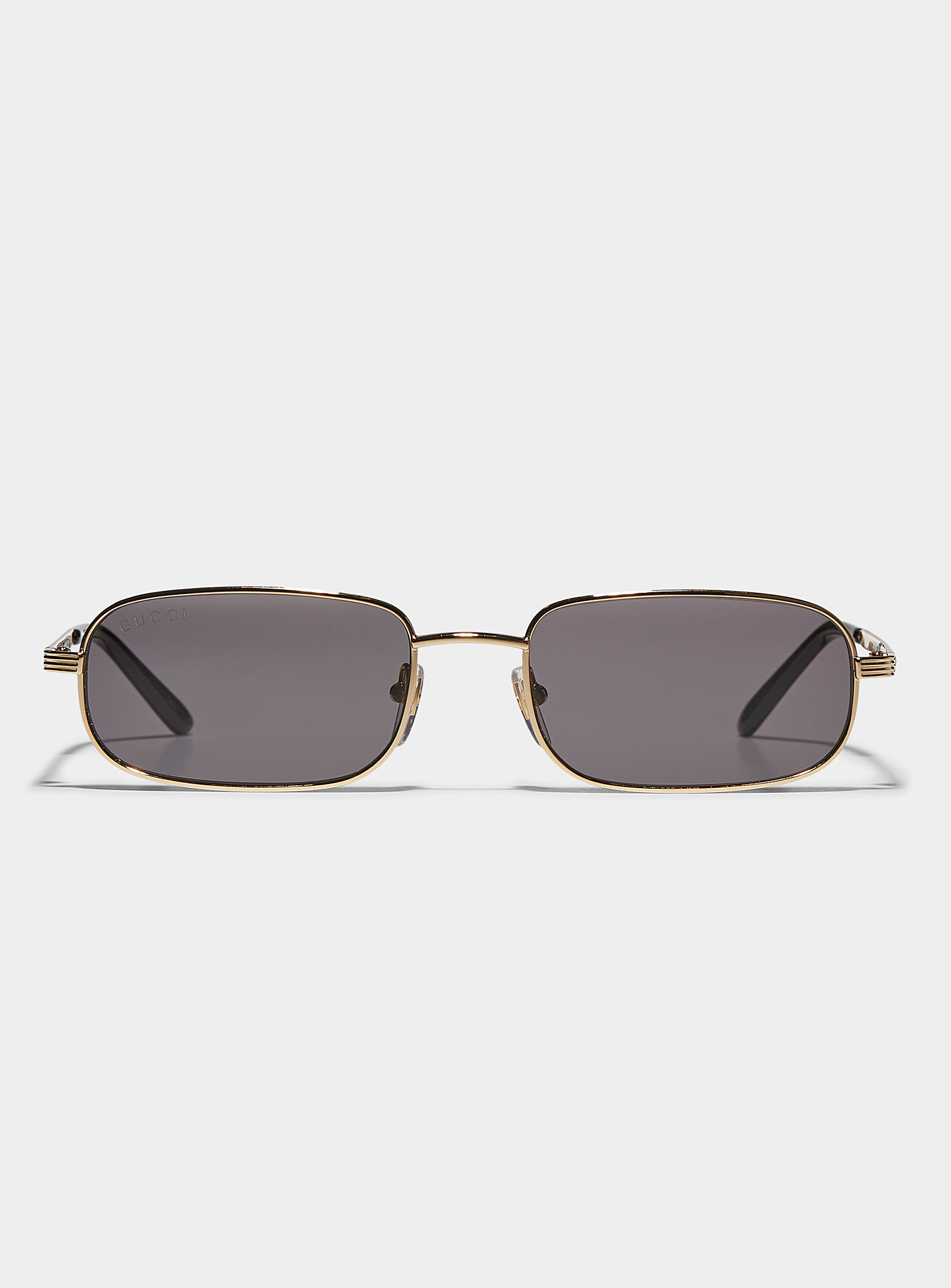 Gucci Sleek Golden Sunglasses In Black