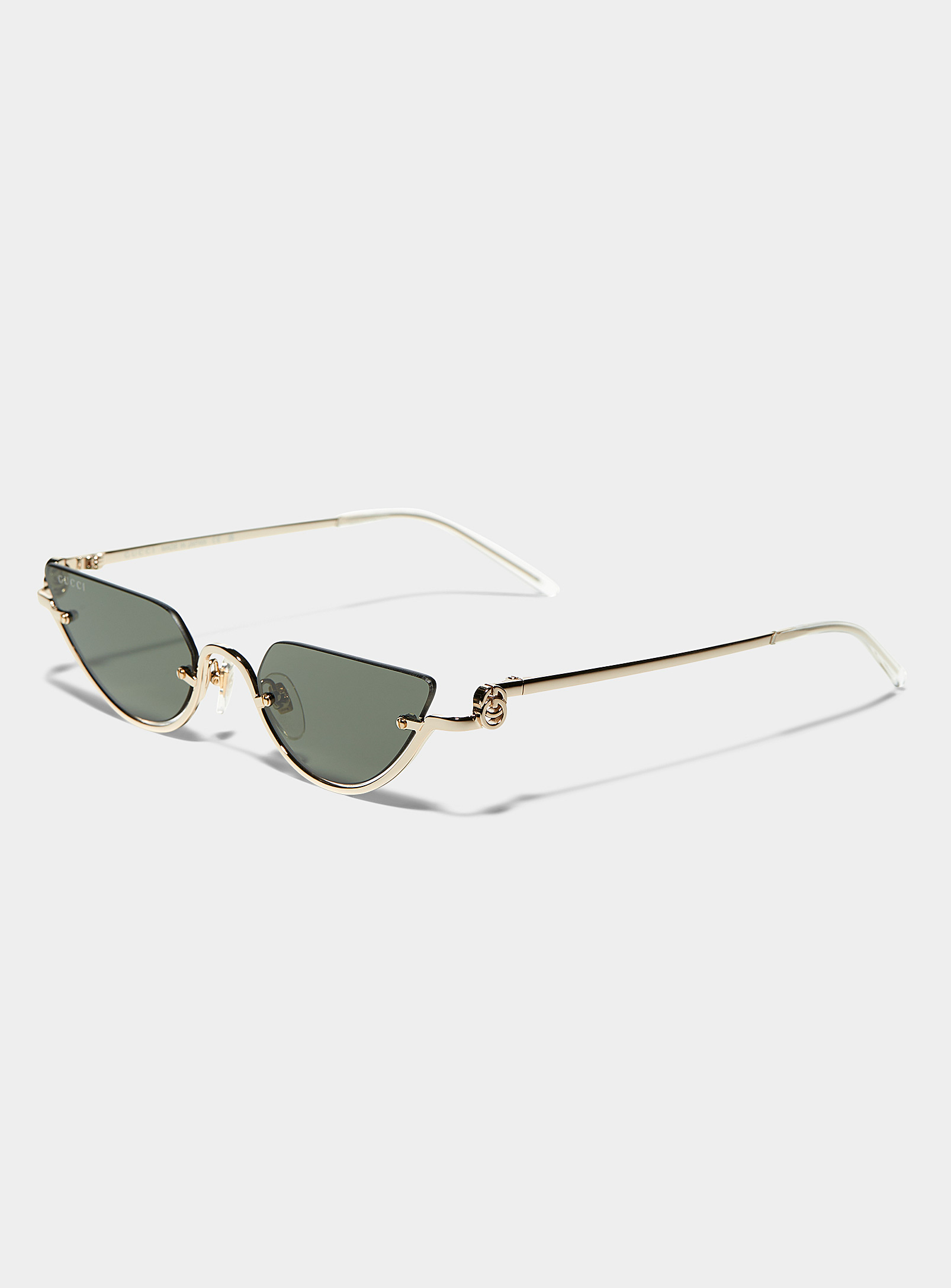 Gucci - Les lunettes de soleil oeil de chat demi-lune