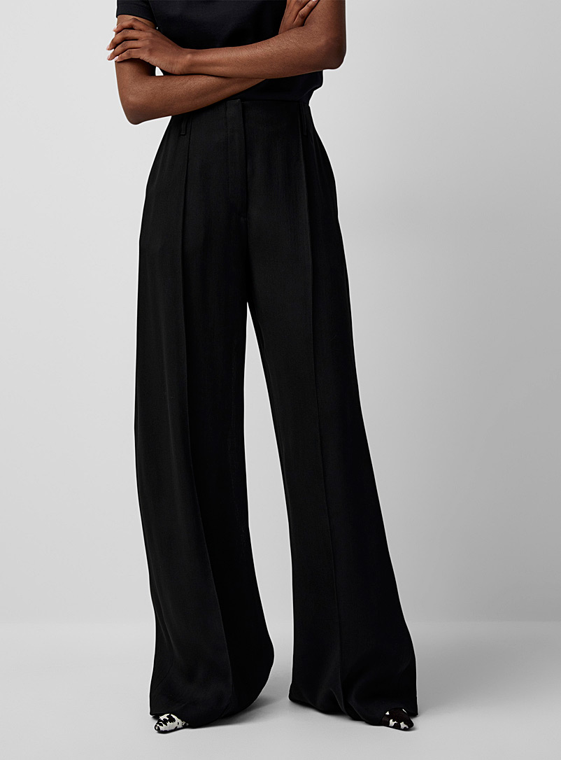 Acne Studios: Le pantalon noir ample Noir pour femme