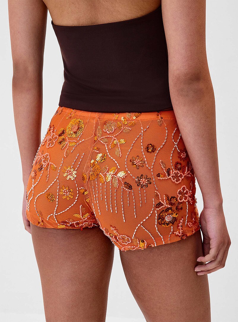 Twik: Le microshort fleurs billes et paillettes Orange corail pour femme